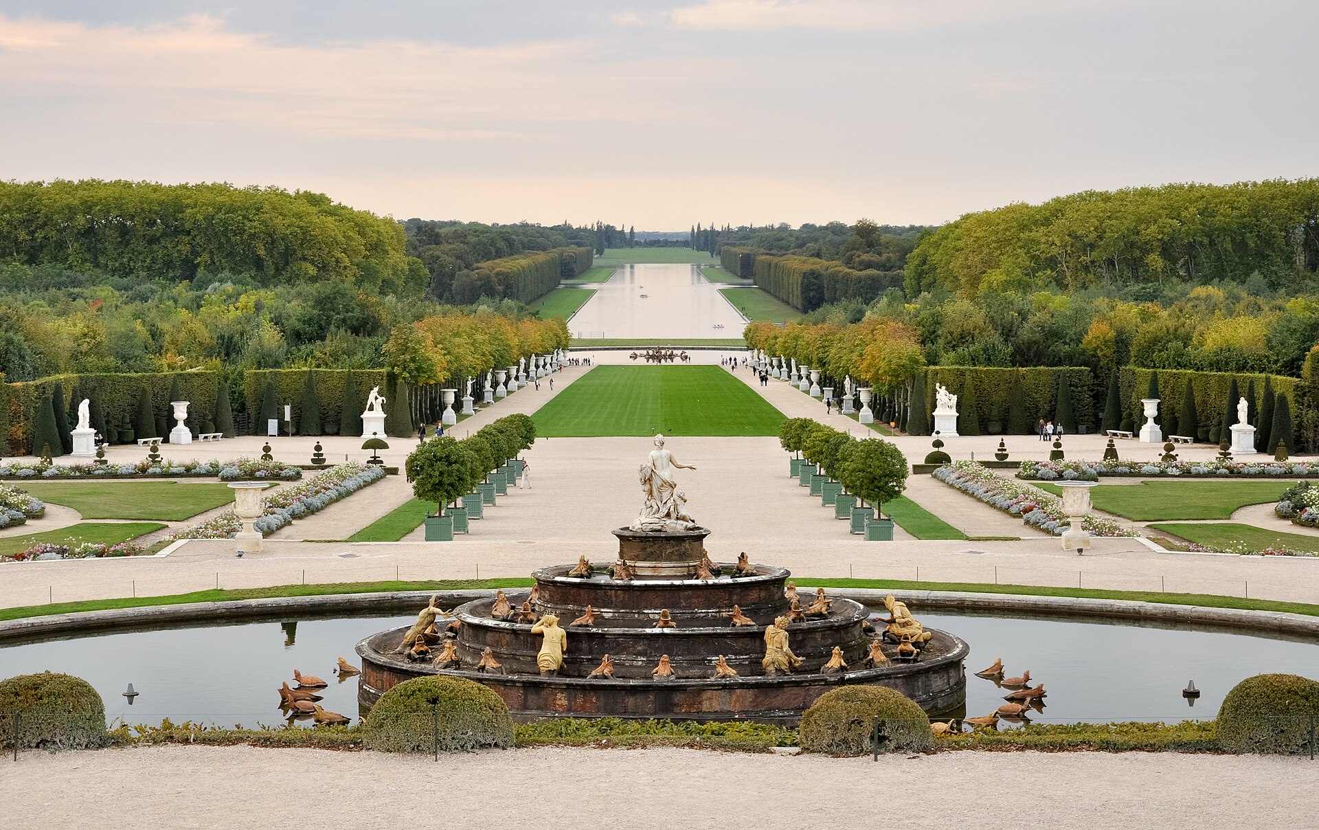 The Grand Axis of the garden, looking from the terrace toward the canal at golden hour